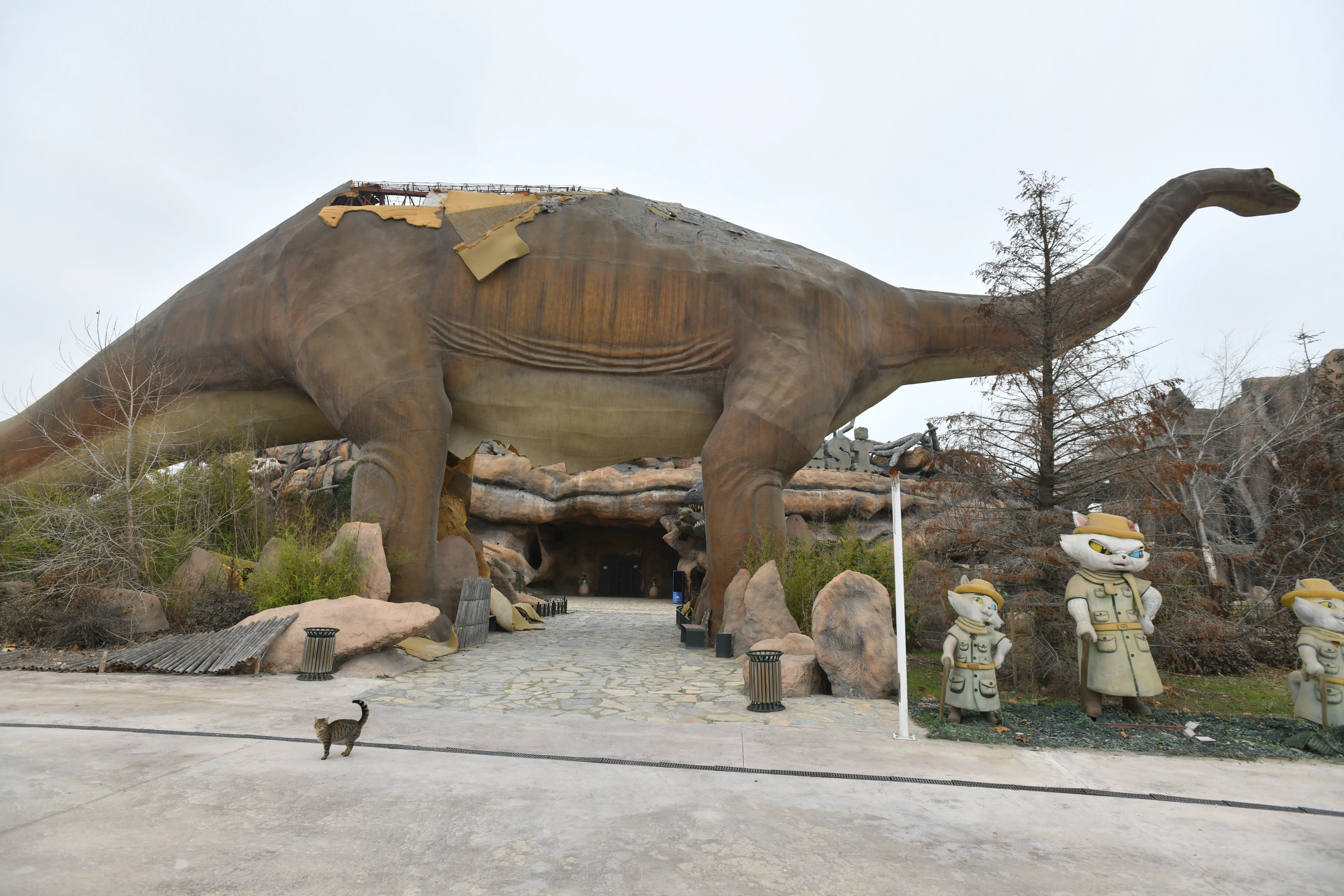 Giant dinosaur figure with peeling skin